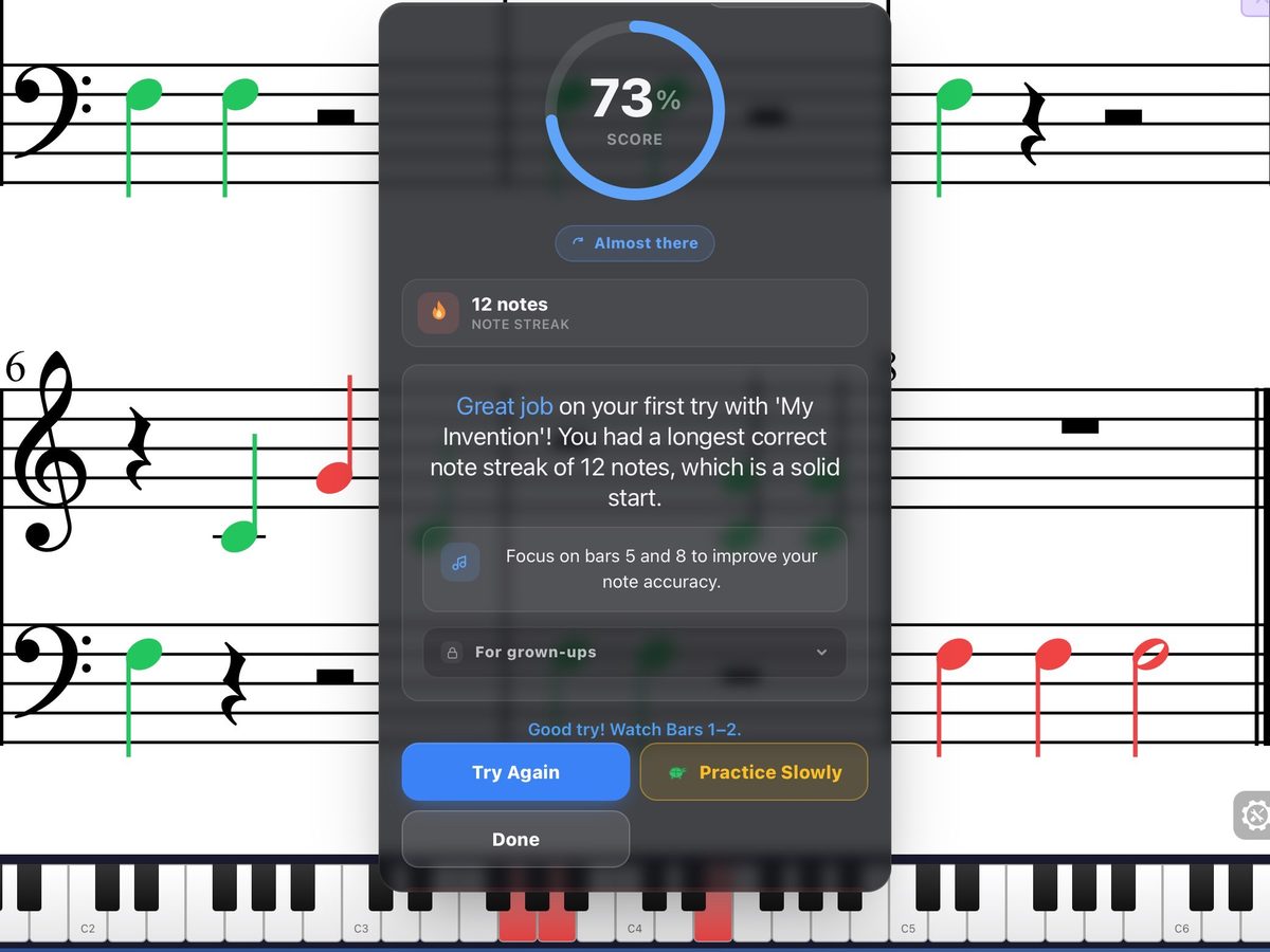 The score screen on iPad: 73%, a note streak, feedback, and which bars to focus on